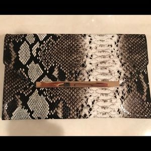 Faux snakeskin black and white clutch